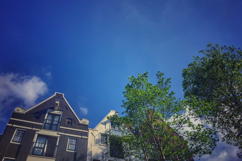 view of leaning homes in amsterdam looking up to the sky