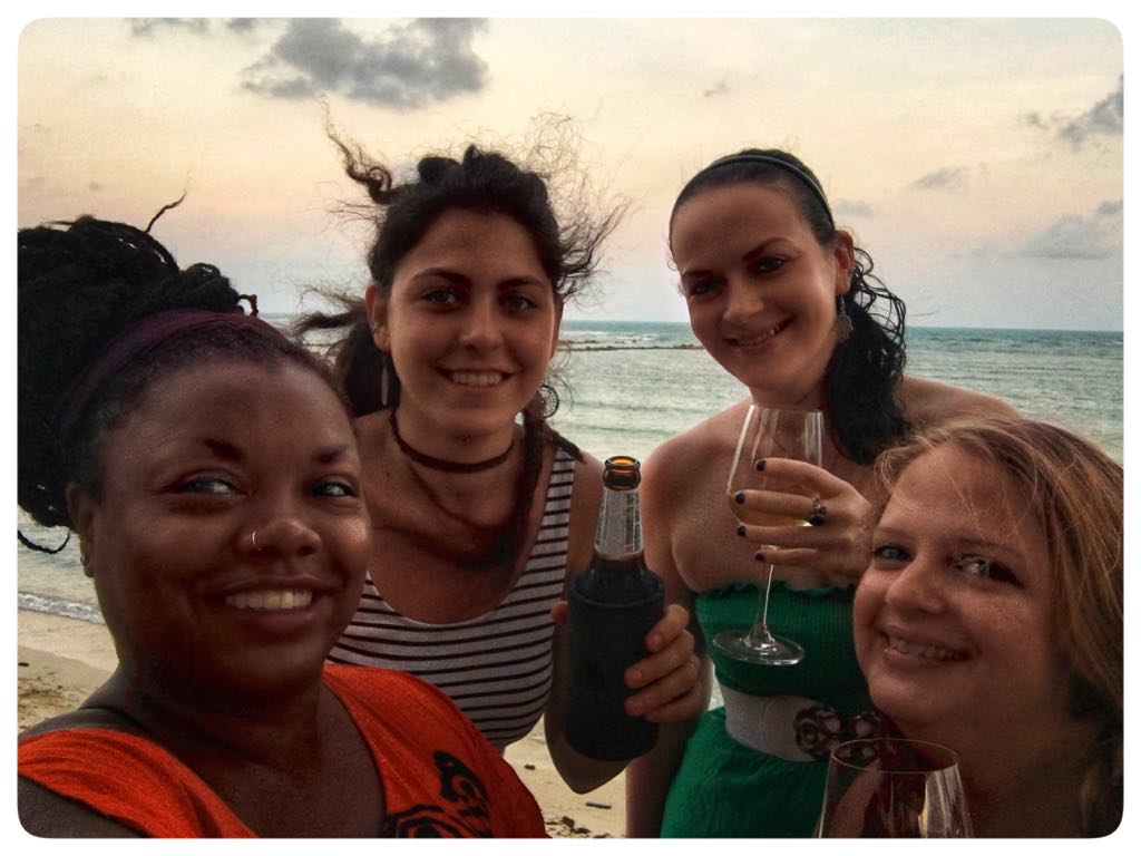 meredith and friends drinking on the beach at sunset, thailand