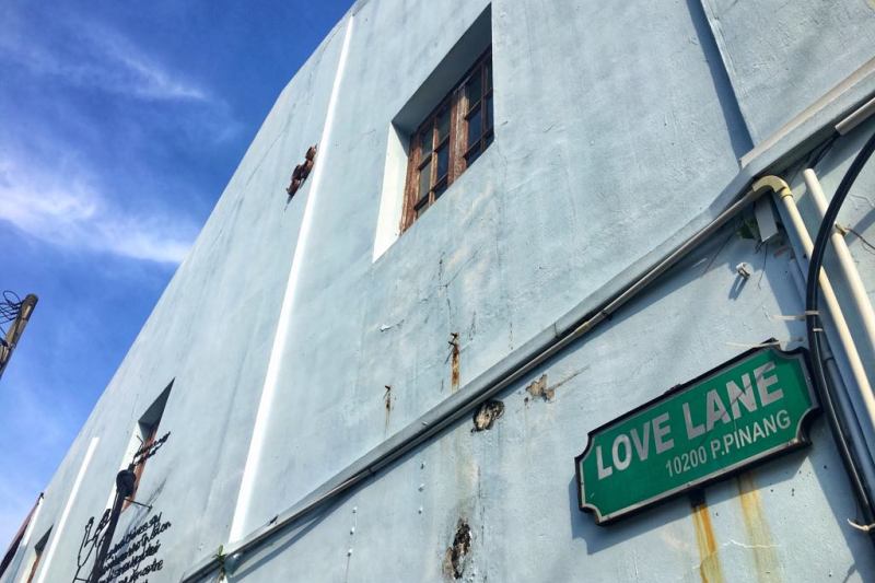 Love Lane signpost on a concrete building