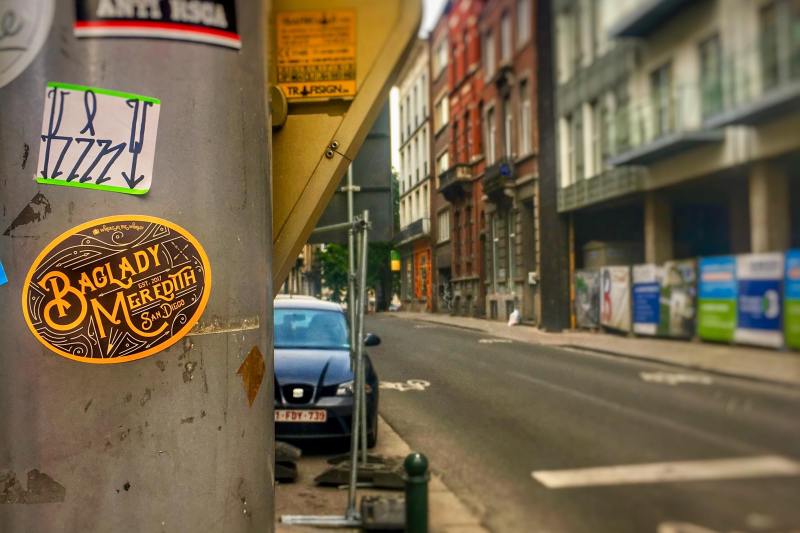 Baglady Meredith sticker attached to metal wall in brussels