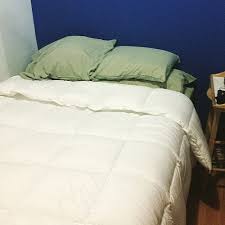 Bed in a room with white and blue walls