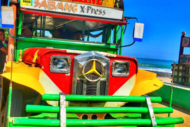 Cebu city to oslob in a colour Mercedes bus the Sabang X-press