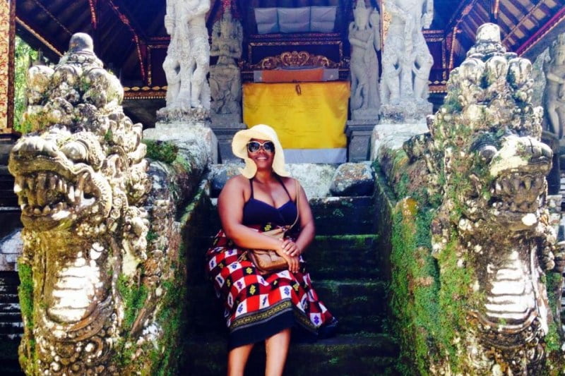 Meredith in the early days on steps of a temple in ubud, bali