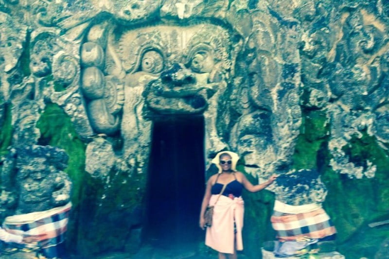 Meredith on a private day tour in Bali at an entrance to a temple