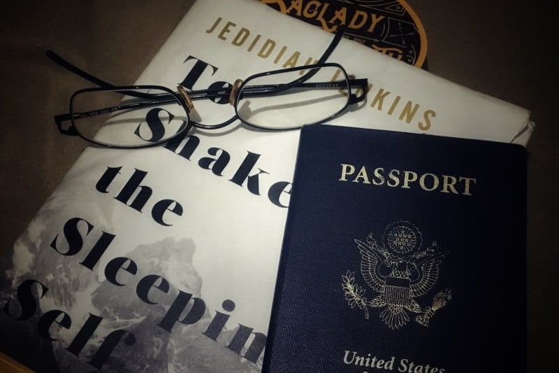 reading recommendations from a bag lady along with the Passport and glasses