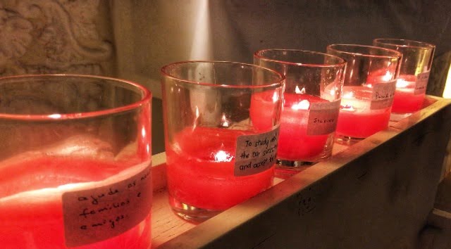 jars of pink candles alight