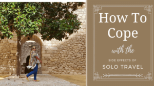 how to cope with the side effects of solo travel pin with Meredith walking in background beside stone building