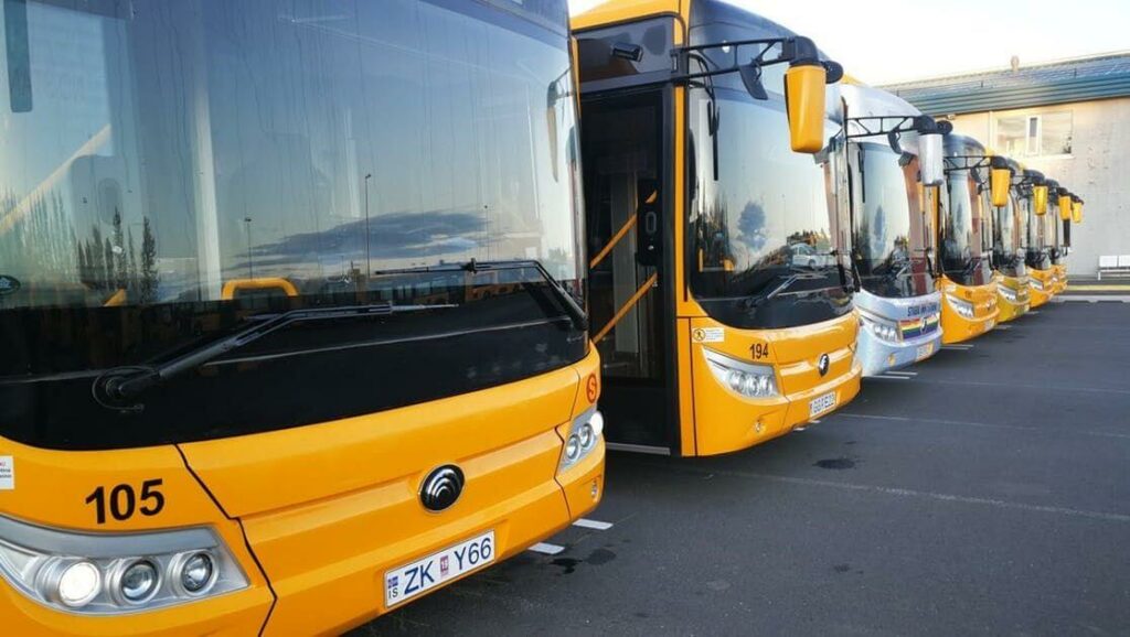 Public transportation buses that are waiting for you and your upcoming Icelandic adventure.