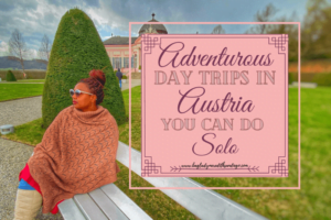 Adventurous Day trips in Austria you can do solo pin with Meredith sitting on white park bench in the gardens of a house and large grassed area