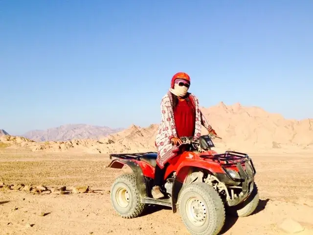 Meredith on a 4 wheeler in the desert