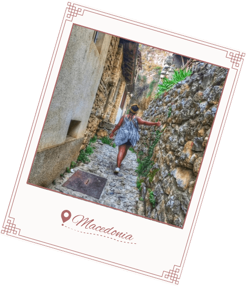 polaroid photo of meredith walking on cobblestones in macedonia