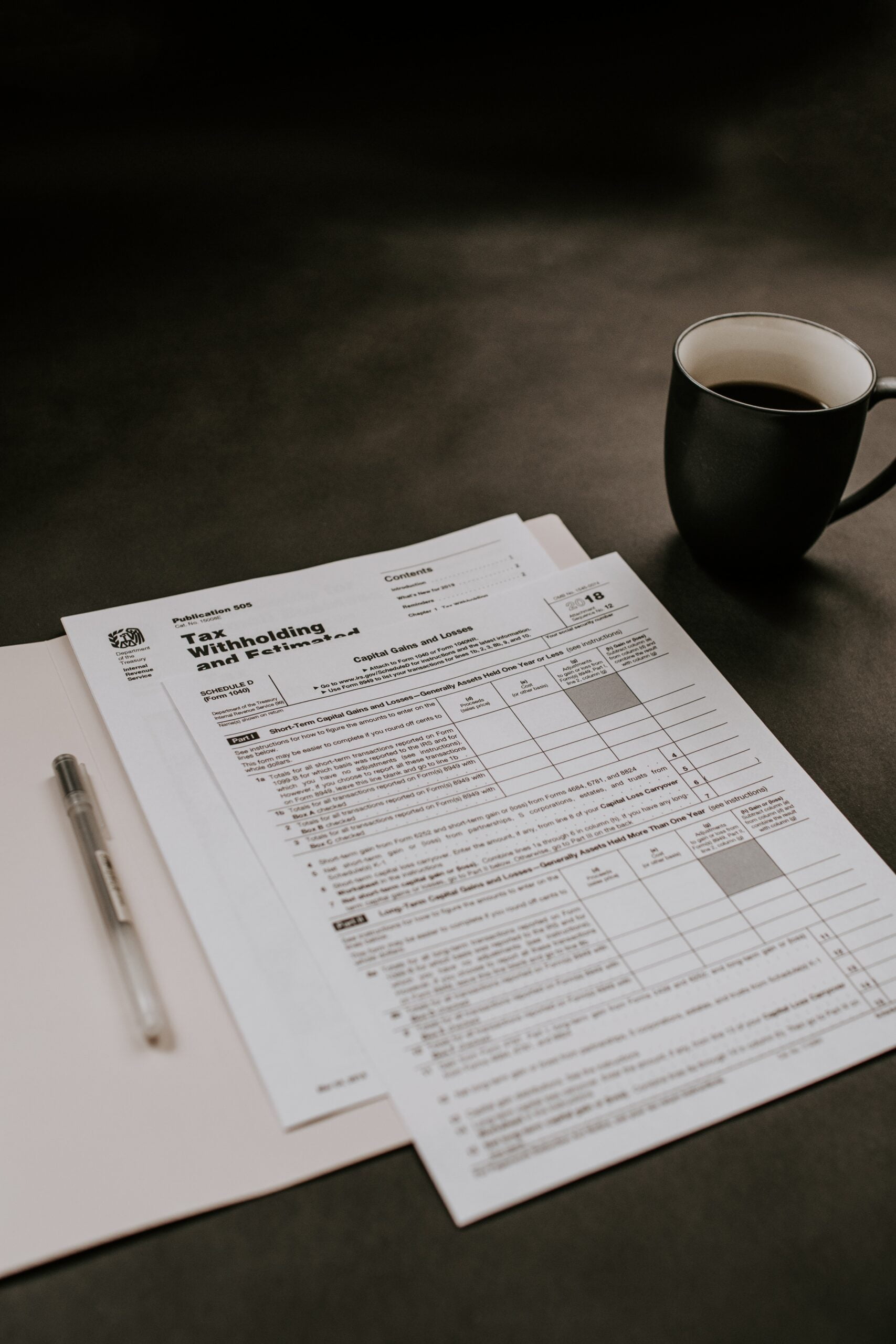 Tax doc and coffee: by Kelly Sikkema as found on Unsplash